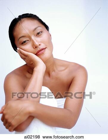 Woman resting chin on hand, portrait, white background View Large Photo Image Stock Photo - Woman resting chin on hand, portrait, white background. Fotosearch