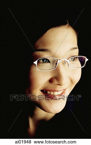 Woman smiling, portrait, black background View Large Photo Image Stock Photo - Woman smiling, portrait, black background. Fotosearch