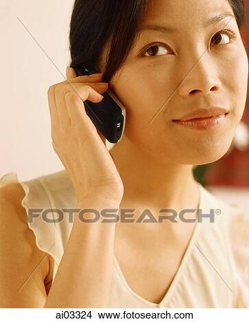 Woman using cellular phone View Large Photo Image Picture - Woman using cellular phone. Fotosearch