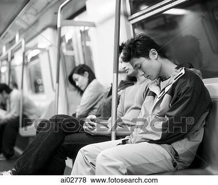 Young adults sleeping on train. View Large Photo Image Stock Photo - Young adults sleeping on train.. Fotosearch