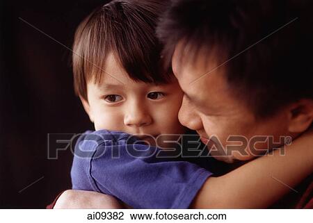 Young boy hugging his father View Large Photo Image Stock Image - Young boy hugging his father. Fotosearch