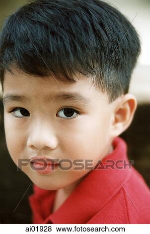 Young boy in red shirt, portrait View Large Photo Image Stock Photo - Young boy in red shirt, portrait. Fotosearch