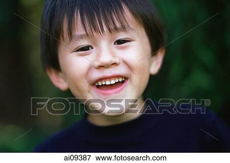 Young boy smiling View Large Photo Image Stock Photo - Young boy smiling. Fotosearch
