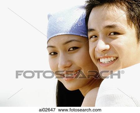 Young couple embracing on beach, portrait View Large Photo Image Stock Photo - Young couple embracing on beach, portrait. Fotosearch