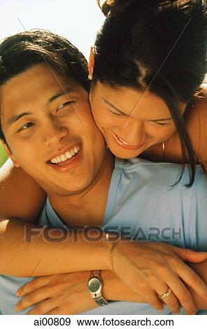 Young couple embracing View Large Photo Image Stock Photo - Young couple embracing. Fotosearch