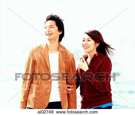 Young couple laughing, city skyline behind. View Large Photo Image Stock Photo - Young couple laughing, city skyline behind.. Fotosearch