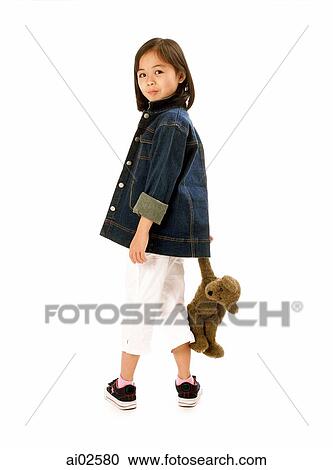 Young girl holding teddy bear, white background. View Large Photo Image Stock Image - Young girl holding teddy bear, white background.. Fotosearch