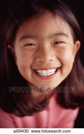Young girl smiling, portrait View Large Photo Image Stock Image - Young girl smiling, portrait. Fotosearch