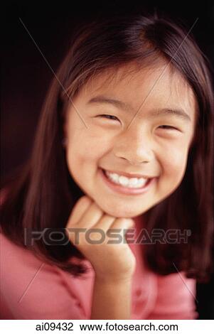 Young girl smiling with hand on chin View Large Photo Image Stock Image - Young girl smiling with hand on chin. Fotosearch