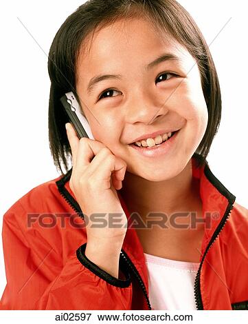 Young girl talking on cellular phone, white background. View Large Photo Image Stock Photo - Young girl talking on cellular phone, white background.. Fotosearch