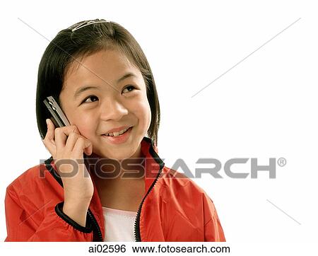Stock Photograph - Young girl talking on cellular phone, white background.. Fotosearch