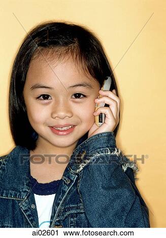 Young girl using cellular phone, portrait, yellow background. View Large Photo Image Stock Image - Young girl using cellular phone, portrait, yellow background.. Fotosearch