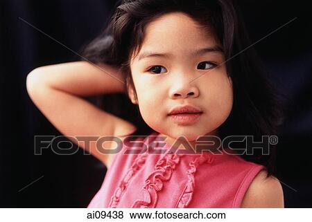Stock Photo - Young girl with hand behind head. Fotosearch