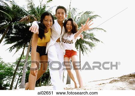 Young group of friends on beach View Large Photo Image Stock Image - Young group of friends on beach. Fotosearch