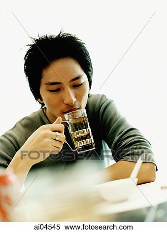 Young man drinking tea, white background. View Large Photo Image Stock Photography - Young man drinking tea, white background.. Fotosearch