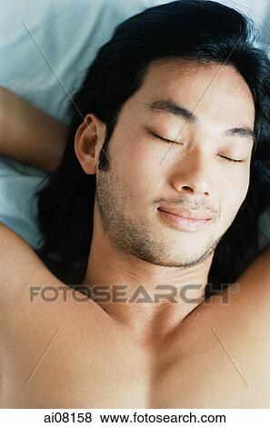 Young man lying, sleeping. View Large Photo Image Stock Photo - Young man lying, sleeping.. Fotosearch