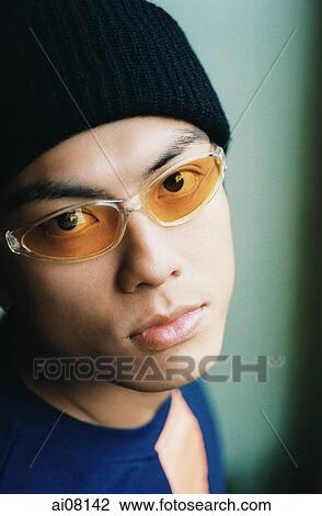 Young man wearing sunglasses and cap. View Large Photo Image Stock Image - Young man wearing sunglasses and cap.. Fotosearch
