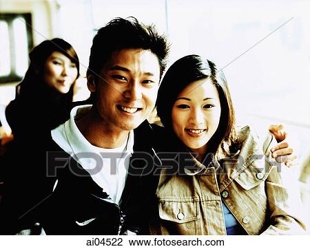 Young man with arm around woman, portrait. View Large Photo Image Stock Image - Young man with arm around woman, portrait.. Fotosearch