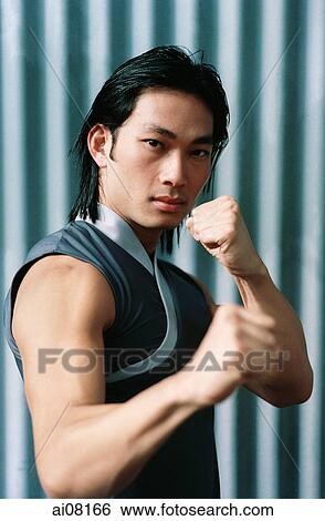 Young man with kung fu hands gestures. View Large Photo Image Stock Photograph - Young man with kung fu hands gestures.. Fotosearch