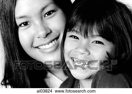 Young woman embracing young girl View Large Photo Image Picture - Young woman embracing young girl. Fotosearch