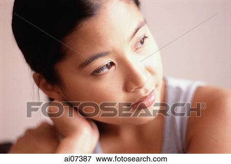 Young woman, hand on head, looking away. View Large Photo Image Stock Photo - Young woman, hand on head, looking away.. Fotosearch