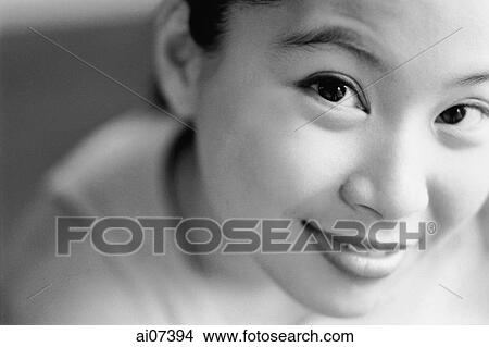 Young woman looking up, smiling. View Large Photo Image Picture - Young woman looking up, smiling.. Fotosearch