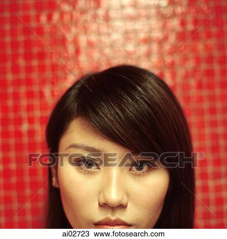 Young woman, portrait, orange/red background. View Large Photo Image Stock Image - Young woman, portrait, orange/red background.. Fotosearch