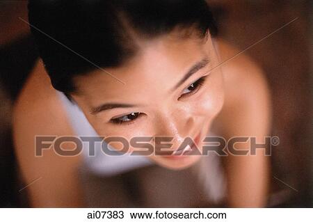 Young woman smiling, overhead view. View Large Photo Image Stock Image - Young woman smiling, overhead view.. Fotosearch