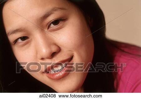 Young woman smiling, portrait View Large Photo Image Stock Photo - Young woman smiling, portrait. Fotosearch