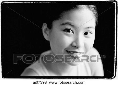 Stock Photo - Young woman smiling, portrait. Fotosearch