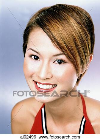 Young woman smiling, portrait View Large Photo Image Stock Photograph - Young woman smiling, portrait. Fotosearch