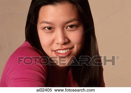 Stock Photography - Young woman smiling, portrait. Fotosearch