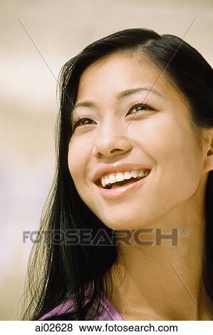 Stock Photo - Young woman, smiling. Fotosearch