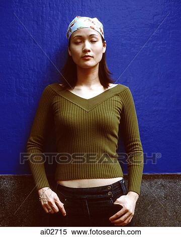 Young woman with eyes closed, blue background. View Large Photo Image Stock Photography - Young woman with eyes closed, blue background.. Fotosearch