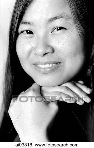 Young woman with hand on chin, portrait View Large Photo Image Stock Photo - Young woman with hand on chin, portrait. Fotosearch