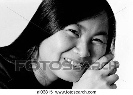 Stock Photography - Young woman with hand on head. Fotosearch