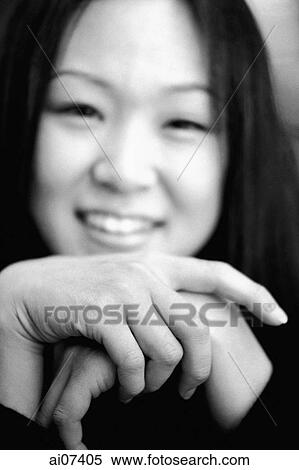 Young woman with hands clasped, smiling. View Large Photo Image Stock Photography - Young woman with hands clasped, smiling.. Fotosearch