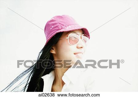 Young woman with purple hat and sunglasses looking away, white background View Large Photo Image Stock Photo - Young woman with purple hat and sunglasses looking away, white background. Fotosearch