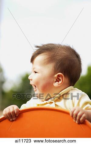 Baby girl, looking away View Large Photo Image Stock Image - Baby girl, looking away. Fotosearch
