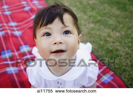 Stock Photography - Baby girl looking up, portrait. Fotosearch