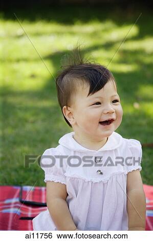 Baby girl on picnic blanket, looking away, portrait View Large Photo Image Stock Photograph - Baby girl on picnic blanket, looking away, portrait. Fotosearch