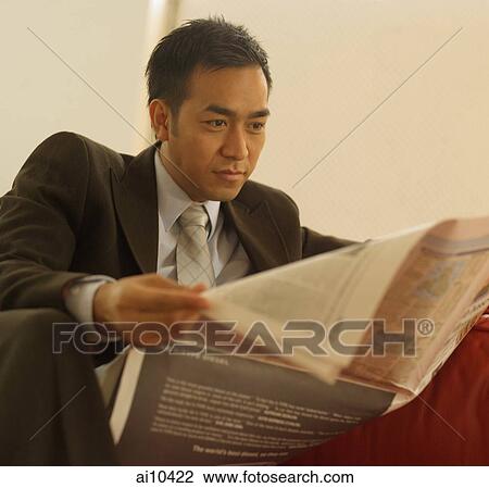 Businessman reading newspaper View Large Photo Image Stock Image - Businessman reading newspaper. Fotosearch