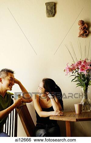 Couple at home, having coffee View Large Photo Image Stock Photograph - Couple at home, having coffee. Fotosearch