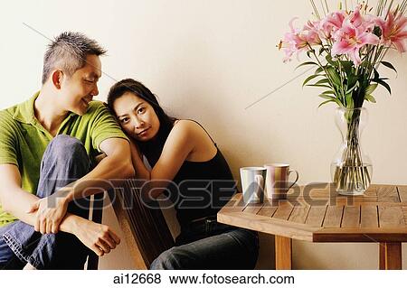 Couple at home, woman looking at camera View Large Photo Image Stock Photo - Couple at home, woman looking at camera. Fotosearch