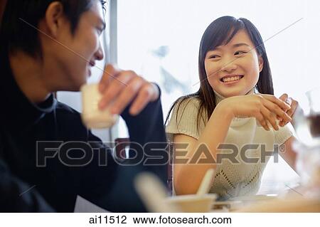 Couple at restaurant, drinking tea. View Large Photo Image Stock Image - Couple at restaurant, drinking tea.. Fotosearch
