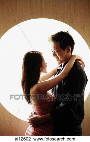 Couple embracing, face to face View Large Photo Image Stock Image - Couple embracing, face to face. Fotosearch