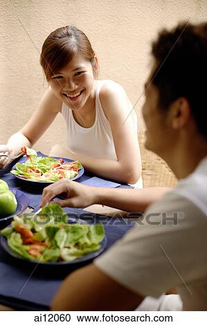 Couple having lunch at home View Large Photo Image Stock Image - Couple having lunch at home. Fotosearch