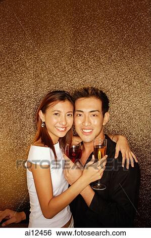 Couple hugging, looking at camera View Large Photo Image Stock Photograph - Couple hugging, looking at camera. Fotosearch