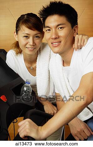 Couple in gym, looking at camera, portrait View Large Photo Image Stock Image - Couple in gym, looking at camera, portrait. Fotosearch
