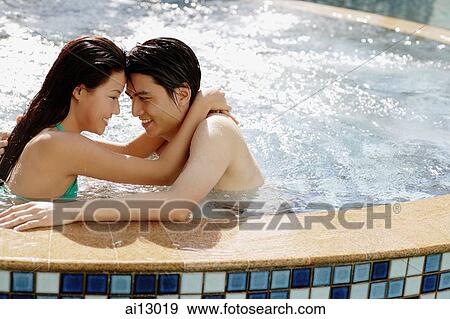 Couple in hot tub, hugging View Large Photo Image Stock Photo - Couple in hot tub, hugging. Fotosearch
